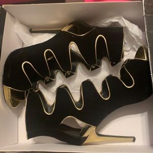 Black and gold heels